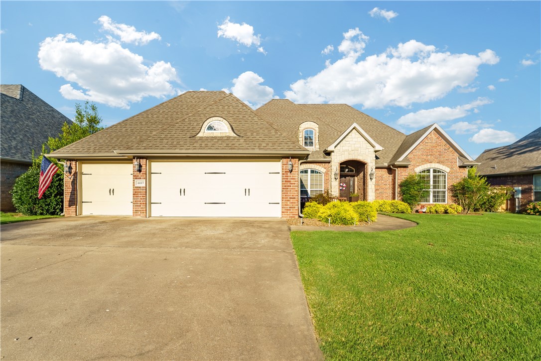 Beautifully landscaped with a welcoming front seating area, this home is ideally located near top-rated schools, restaurants, and NWA favorites like Top Golf, Walmart AMP, and Pinnacle Hills Promenadeāplus just a 2-minute bike ride to the Greenway Trail! Inside, you'll find arched hallways, a butlerās pantry, tile flooring with carpeted bedrooms, and stunning wood beams in the living room and primary suite. Enjoy a cozy gas fireplace, formal dining, and a newly fenced backyard with an additional fenced in side yard, perfect for pets or play. The backyard features a built-in fence around the porch, a paved walkway to a fire pit and seating area, and a covered deck with gated access to the yard. The deck is accessible from the kitchen, living room, and primary bedroom. The primary suite includes a jetted tub, double vanity, walk-in closet, and private porch entry.