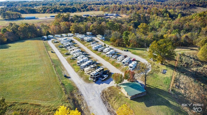 Located just 5 miles from the War Eagle Marina this income producing RV Park is a popular Beaver Lake retreat! 100% occupied with a waiting list, there are endless ideas to expand and improve on this 22 acres of income generating paradise! Possibility to add an additional 12 - 20 spots with room remaining for more revenue producing glamping and traditional tent campsites, as well as picnic areas and walking trails. Ponds are fed by year round streams flowing through the property--perfect for stocking and fishing! Currently there are 30 50 amp spots, 8 30 amp spots, new shop building, newly updated office and bathrooms, and opportunity at an established turnkey business with management available for hire.Plans available for community garden/greenhouse area.