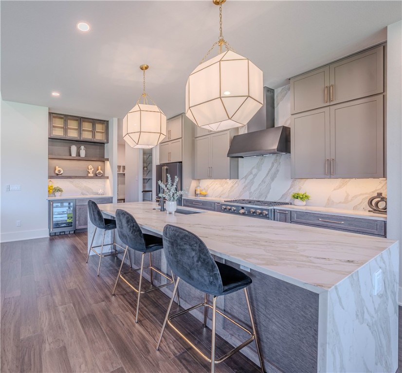 Crafted by the 2024 Parade of Homes Gold Medal-winning builder, The Laney floor plan in the sought-after Aurora community offers the perfect balance of luxury and livability. This stunning two-story home features 5 bedrooms, 4.5 bathrooms, and refined finishes throughout. Designed with modern families in mind, the home showcases a waterfall quartz kitchen island, premium Café appliances, oversized windows, and a seamless indoor-outdoor flow ideal for entertaining. The elegant main suite is a true retreat, complete with a soaking tub and walk-in shower, while additional spaces are thoughtfully planned for both gathering and quiet moments—including areas tailored for children to learn, play, and grow. With stylish interiors, a three-car garage, and placement in the highly rated Bentonville School District, The Laney is where comfort meets convenience in every square foot.