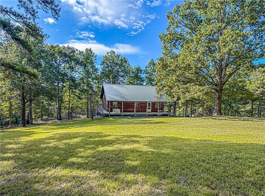?? Rustic Log Cabin Retreat on 5 Acres – Only 10 Minutes from Town! ??

Escape to your own slice of cozy, country paradise with this 2,000 sq. ft. log cabin, perfectly blending rustic charm and modern comfort. Nestled on 5 beautiful acres, this 3 bed, 3 ba log home offers vaulted ceilings, covered wrap around porches or outdoor living space, gas log fireplace, your own stocked pond, and 30 X 40 (approx.) concrete pad could be used for a shop— all just 10 minutes from town!