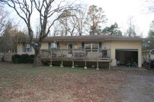 Close to town, but at the end of a dead end road, you will find this secluded 3 bedroom 1.5 bathroom brick home. This home offers a front deck with gates, making it safe for young children or pets. Comes with a one car garage and an additional carport. There is a storm cellar in the back yard, and a playset the kids will love. Fenced backyard with garden area and a place for chickens. Come and see this listing today!