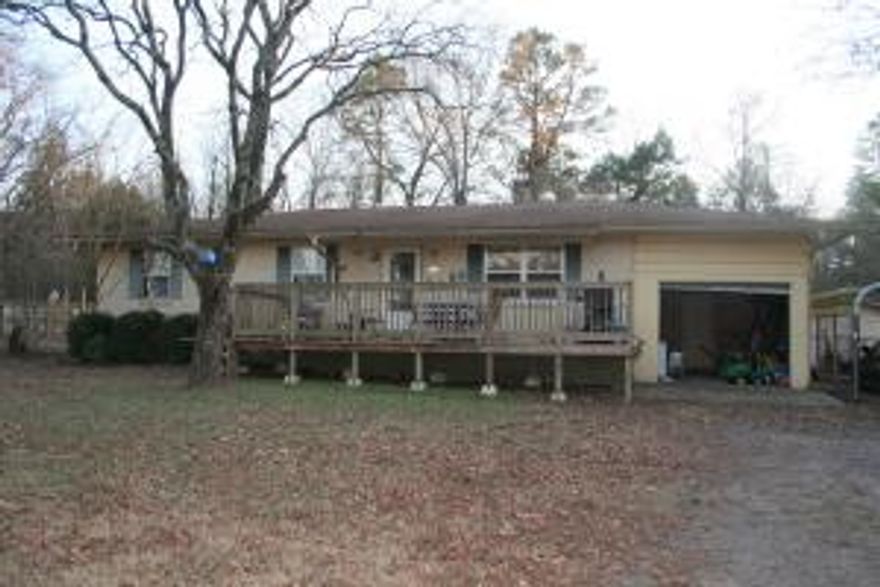 Close to town, but at the end of a dead end road, you will find this secluded 3 bedroom 1.5 bathroom brick home. This home offers a front deck with gates, making it safe for young children or pets. Comes with a one car garage and an additional carport.  There is a storm cellar in the back yard, and a playset the kids will love. Fenced backyard with garden area and a place for chickens. Come and see this listing today!