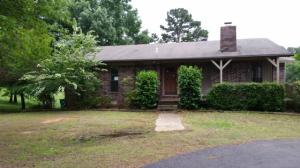 Comfortable country living at it's best! This 2250sft m/l(per tax records) 3 bed 3 bath home has a country feel while being close to town and thelake. With two levels with a walk out below and wrap around porch above this home sits on 1.5 acres m/l. With a 2 car detached garage, outbuildings and fenced in area for animals just a little TLC and this will be a home to be proud of. From the living
