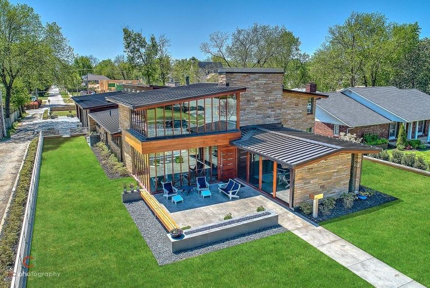 DOWNTOWN BENTONVILLE MID-CENTURY MASTERPIECE set on a rare .53 acre lot that runs street to street b/w Central Ave and SW 2nd Street! Private drive w/ entrances off both streets & electric privacy gate off 2nd St. Built in 1954, this home underwent an extensive remodel completed in 2018 & features 6,286 sq ft of living space w/ a 1,404 sq ft heated & cooled oversized 4 car garage w/ full kitchen. 3 bedrooms on main level including the luxurious 1,600 sq ft master retreat w/ 16’ ceilings, custom 14’ fireplace, private patio, boutique style closet w/ safe room attached, & amazing spa bath. Temp controlled wine cellar holds 1,000 bottles. Amazing kitchen w/ high-end Wolf & Subzero appliances & European style modern motorized touch open & close cabinets. Second floor hosts entertainment room & en suite bedroom. 5 fireplaces, 3 indoor/2 outdoor, w/ 3 outdoor living spaces. Smart home running the audio, lighting & motorized shades from wall touch switches, iPhone or iPad.