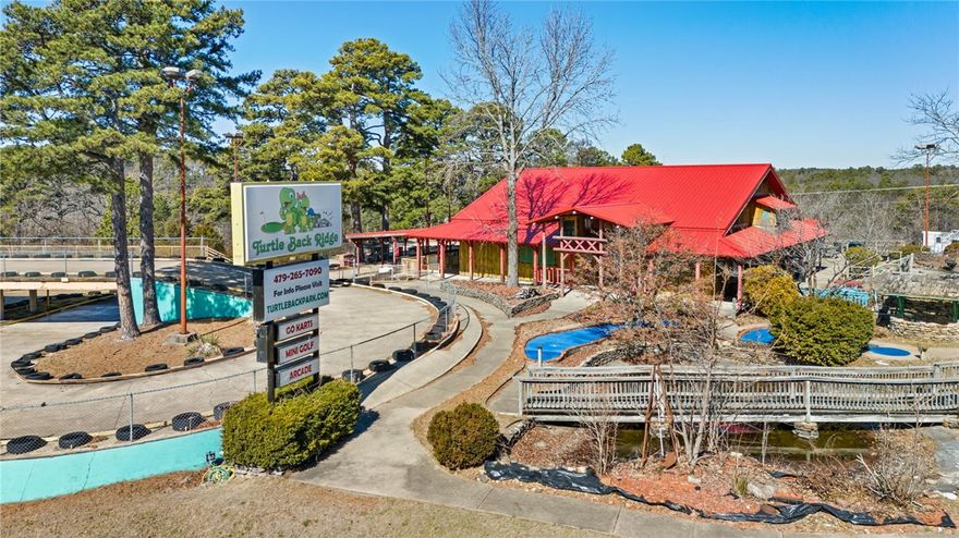 Searching for a great business opportunity in the beautiful Ozark Mountains? The iconic Turtle Back Ridge Family Fun Park in Eureka Springs is a turn key operation & ready for the next generation entrepreneur. Located directly on Hwy 62, ARDOT reports this property to have an estimated daily traffic count of almost 8,000. Sitting on almost 9 acres, this active business includes: 36 holes of Mini Golf w/ newer greens, Batting Cages, Go Carts, Arcade, & Snack Bar. The upper level of the main building is the hub of operations. It is an approx 48x48' open space that could be transformed into a restaurant, pub, retail space, music venue... It has a new metal roof & one of two AC units was just replaced. The full walkout basement is utilized as workshop, offices, storage, & employee restroom. The lower part of the property, has additional parking & a 40x25' metal building w/ roll up door. Bring your ideas & dare to dream, the potential is unlimited! Shown by appointment only. *Pictures taken during winter, in off season.