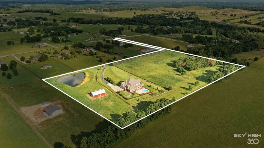 Beyond its orchard and waiting at the terminus of its long private driveway lies this elegant estate home tucked away on nearly 18 acres of peaceful land in Tontitown.  This private pristine home has an open concept floor plan, executive office, majestic grand master-suite, gym, media room, family room, game room, central vac, surround sound, outdoor bathroom, guest suite, and so much more to mention here! Here, there are endless possibilities to create memories with loved ones and friends. Come enjoy the sounds of the outdoors, read a book by the sparkling pool, ride horses, walk in the garden, pick fruit from the orchard and make jams & pies in your gourmet kitchen, or simply watch the gorgeous sunsets from your cozy, covered backyard porch! One will feel like they are at a retreat! The estate indulges in the surrounding outdoors & yet is only a few miles from shops, wineries, restaurants, & baseball games at the Arvest Stadium in Springdale or close to Fayetteville city amenities! Live a life you will love!