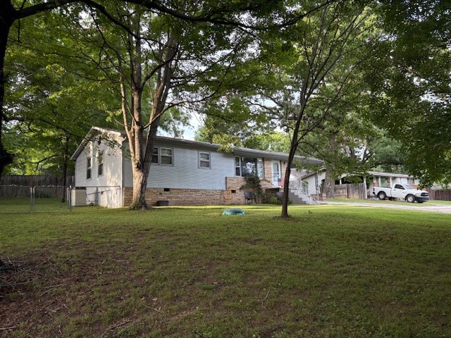Convenient location for this 3 bedroom 1 bath home with hardwood floors, large eat-in kitchen, and a covered deck for cook outs and entertaining. It has central heat and air, plus a back up gas wall heater. The storage building in the back yard has a new roof. One of the bedrooms has door to access the deck, and it could be used as a den or office, and the bathroom has walk in shower. With a little work, this will be a great home for you! Water and sewer lines from house to street were replaced a few years ago, and new central heat in 2019. Seller is offering allowance to cover cost of new roof.