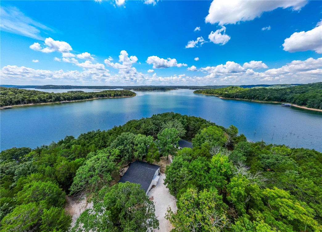 You will appreciate the close distance and level walk to the waterfront. This truly is a lakefront gem, so don't wait, its time to make your lake life dream a reality.
Discover a haven of tranquility with these lakefront 7 bedroom, 4.5 bathroom homes. Currently thriving as a nightly rental with future bookings, this is not just a home, but an investment.
Whether you're looking to unwind in style, or entertain guests, this property delivers on all fronts. Dive into a life of fun and relaxation in a place where every day feels like a getaway.
The updates throughout the home include new flooring, new paint, appliances, roof, HVAC systems, hot water heaters, cabinets, countertops & most bathroom fixtures. The property is comprised of 3 structures. This includes the 1,796 sq ft main home that includes 3 bedrooms & 2 bathrooms. A 1,403 sq ft guest house that includes 4 bedrooms & 2 baths. And a 1,064 sq ft game room with a half bath & garage. Additionally there is a 2 car detached carport.