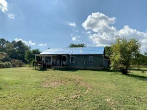 Nearly 2 acres of meadows minutes from Clarksville near Lake Ludwig - property consists of an old home place - 1 story solid frame home w/replaced sill plate and new decking on front of roof, a shed, detached carport, and Gambrel Roof Barn. Located on paved county rd w/ all utilitieson site and driveway in place. Perfect project for the experienced carpenter or build a new home within the trees behind the existing structures.Desirable location to call home. Attached particle survey. Owners will adjust the south property line to include the barn upon request. Partiallyfenced!