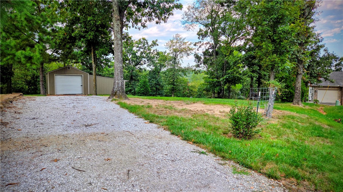 Lot is clear and has 775 SF Storage building with overhead door. Located minuets from Lake Loch Lomond. Approved borrowers will receive a closing cost credit of 1% of the loan amount up to $5,000 on their Closing Disclosure on their loan closing with Envoy Mortgage Branch NMLS #2659248 and Branch NMLS #2579798