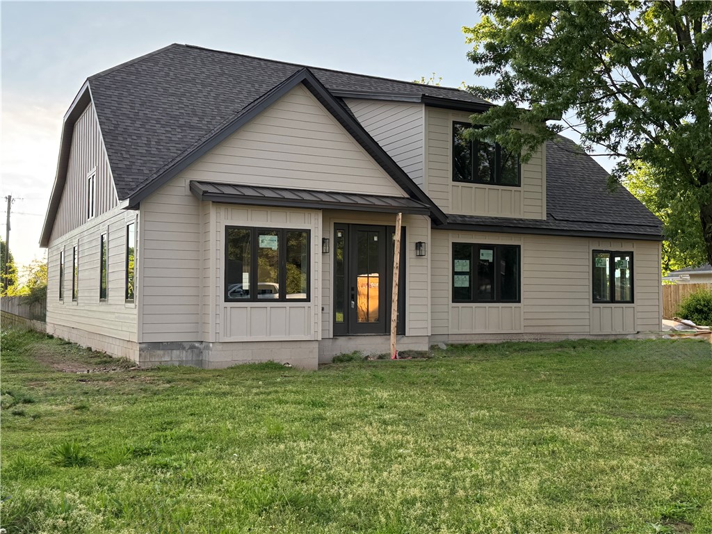 Welcome to 502 Concord St—built by award-winning builder Key Concepts, where every detail feels like a custom home, not a typical spec. This 3 bed, 3.5 bath home sits on a .41-acre lot in Lowell with nearly 3,000 sq ft of thoughtful design. Features include cathedral ceilings with beams, a coffered ceiling in the primary suite, and a spa-style wet room with soaking tub and walk-in shower. The kitchen includes an oversized island, walk-in pantry, under-cabinet lighting, and custom cabinetry with built-ins like trash/recycle and cookie sheet storage. Enjoy the sunroom off the living room that opens to a backyard deck—perfect for relaxing or entertaining. Upstairs offers two bedrooms with private en-suite baths and a versatile loft. Added perks: mudroom with cubbies, powder bath, tankless water heater, Google smart thermostat, and a 2-car side-load garage. The On-Q data box acts as a central hub to organize and distribute your home tech with ease. The spacious backyard offers room for a future pool or pool house.