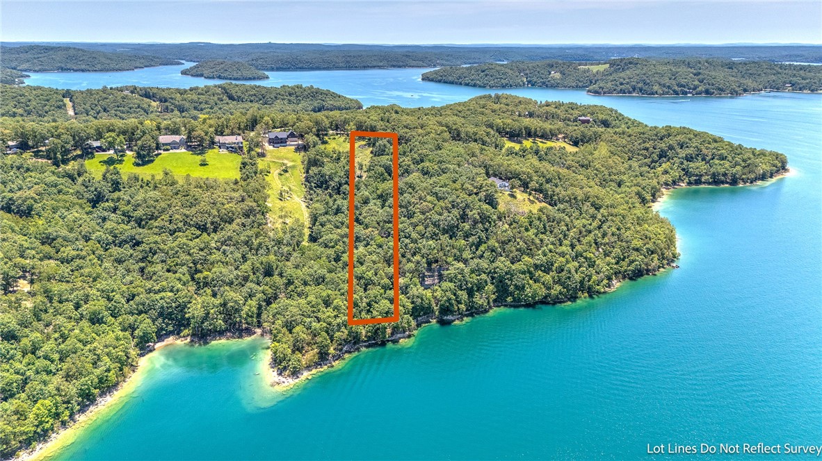 Discover your slice of paradise with this prime lake view property, offering breathtaking panoramic views and unparalleled tranquility. Nestled near the shores of Beaver Lake, this expansive lot spans 3.31+/- acres of pristine land, providing ample space for your dream home or vacation retreat. Located near Starkey Marina!