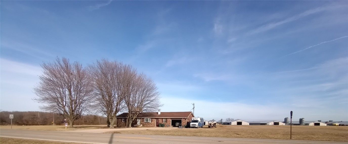 6 house poultry farm on approx. 13 acres of ground (more or less) offers 2 wells and a city water connection for back up. Currently has Tysons contract, these poultry houses have been updated and all 6 houses have a 1000 gallon propane tanks that will convey at closing. Stacking shed with compost boxes, pole shed, a utility building and 2 smaller metal storage buildings. 2 homes in great condition on this farm make for a perfect extended family or farm hand quarters. Need a Barn ? yep.. its there. The property can be fenced to suit a few head of livestock. Farm life is the best life. Don't miss out- Call today!