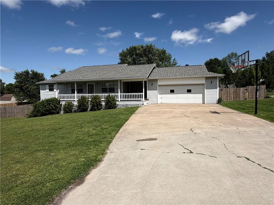 Exceptionally well maintained 3 bed, 2 bath home with a finished walk out basement on over a half acre lot in an established quiet Pea Ridge neighborhood! Upstairs has 3 bedrooms and 2 full baths with granite countertops. Real hardwood floors through main living area and master bedroom. Downstairs includes a large open area and one separate (non-conforming) bedroom/office etc. along with large storage areas. Enjoy outdoor living on the large deck which also has garden/planter boxes in the big back yard which has 2 large storage buildings, 10x16 and 12x20, chicken coop, mature trees and a play set. New privacy Fencing in 2024. New shingles in 2022. West property line is outside of the west fence. It is from the highline pole to the green phone box in the back of the lot. See last picture.
