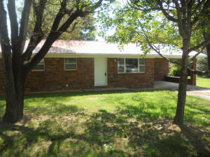 3BR 2BA brick home with metal roof on large level lot. Home has had many recent updates done throughout, comes with new appliances, has large heated and cooled sunroom, large covered back porch. Has unfinished basement for extra storage. Great location on paved county road.