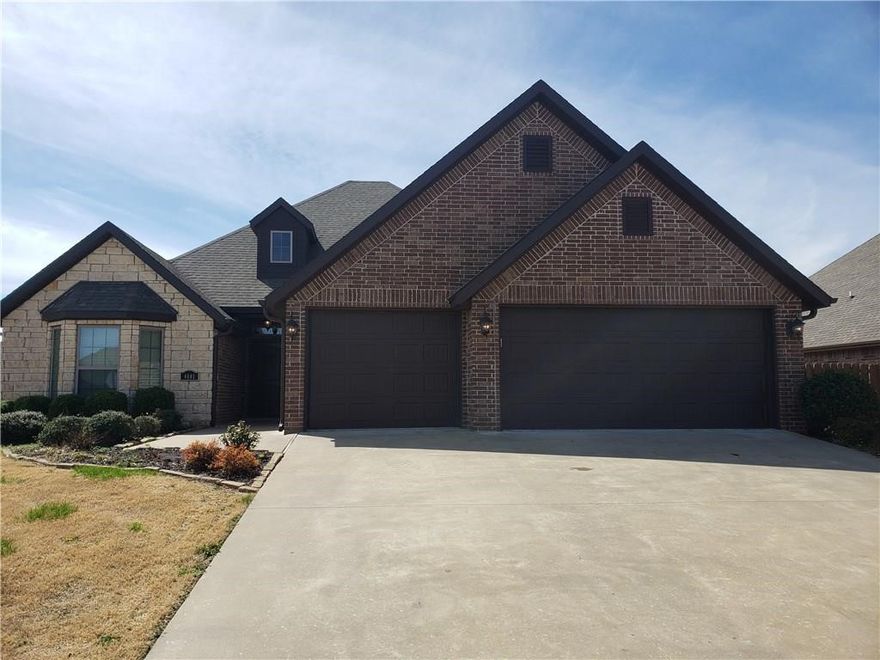 Located just minutes from the Walmart Home Office! This property has it all...lawn irrigation, central vac, vented hood, gas cook top, built-in oven and microwave, 3 cm granite throughout, insulated garage doors, double pantry, surround sound in the living room, and beautiful wood floors. Enjoy the inviting covered back patio with extended stained/stamped concrete and wired for sound...great for entertaining! 6 ft. wood privacy fence with two gates.
