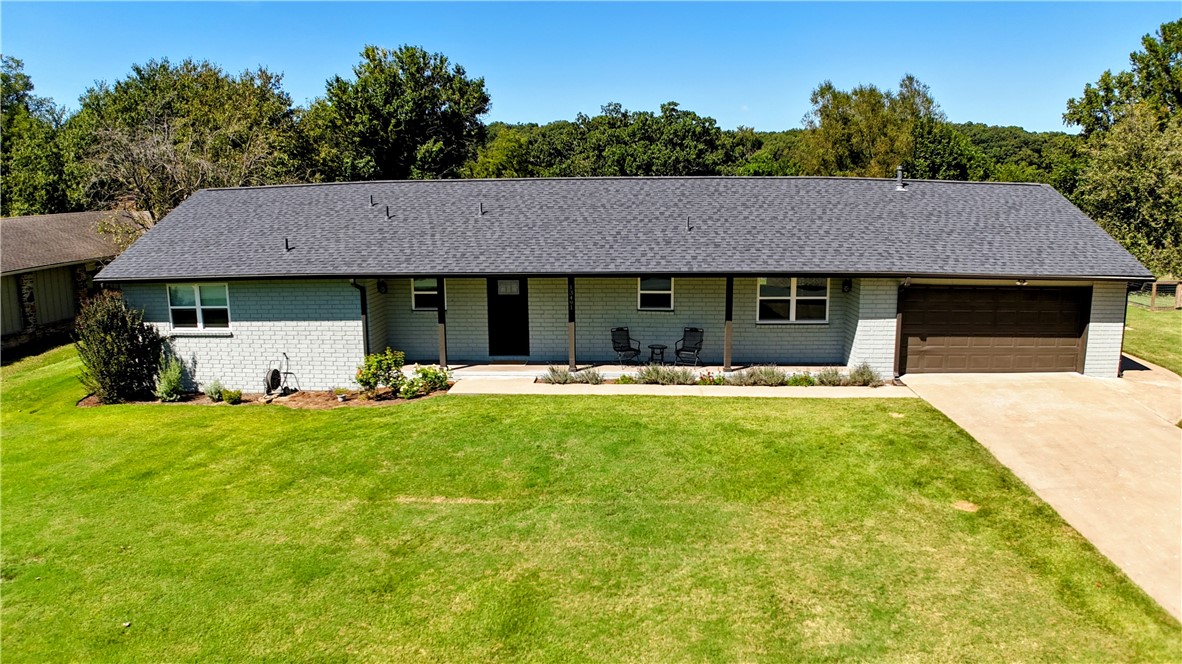 Beautifully updated home offering comfort, style, and functionality! This 3BD 2BA, 2,090SF property sits on a 0.36 acre lot with a 2-car garage & golf cart access. Recent updates include gutters, water heater, LVP flooring & ceramic tile in the kitchen. Kitchen features black SS appliances, butcher block countertops, painted cabinets w/soft-close, new sink & pantry w/pull-out shelving. Additional updates include ceiling fans, light fixtures, switches, plugs, trim, programmable thermostat, door hardware & an energy-efficient windows & front door. Living room features a pellet stove. Sunroom addition is heated/cooled & could be used as home office or flex space. Bathrooms updated w/new vanities, sinks, mirrors, lighting, toilets & clear glass shower doors in the primary bath. Primary closet includes custom shelving system. Exterior freshly painted with added attic insulation. AC was replaced in 2018, Roof was replaced in 2021, HVAC/heat pump was replaced in 2022, please see full list of upgrades in attachments.