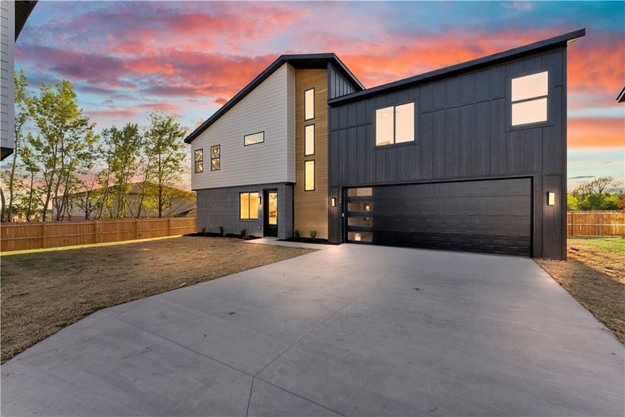 Seller offering $5,000 credit toward closing costs or upgrades! Preferred lender offers a 1% credit on the loan amount, applicable toward closing costs, upgrades, down payment, or other eligible expenses. Enjoy an upscale, low-maintenance lifestyle just over a mile from Pinnacle Hills Promenade and only 2 miles from the Walmart AMP. Residents enjoy top-tier amenities including a saltwater pool, a clubhouse with a kitchen & gym, pickleball court, dog park, playground, paver streets, and bike paths. Each home features custom architectural design and high-end finishes, including Quartz countertops, gloss-finished black or white cabinets with soft-close hardware, and a curated palette of White & Gold or Black and White for a bold, modern look. Each home is equipped with modern interior fire sprinkler system, providing enhanced safety. Pictures are not of the actual house, but similar plan and finish.