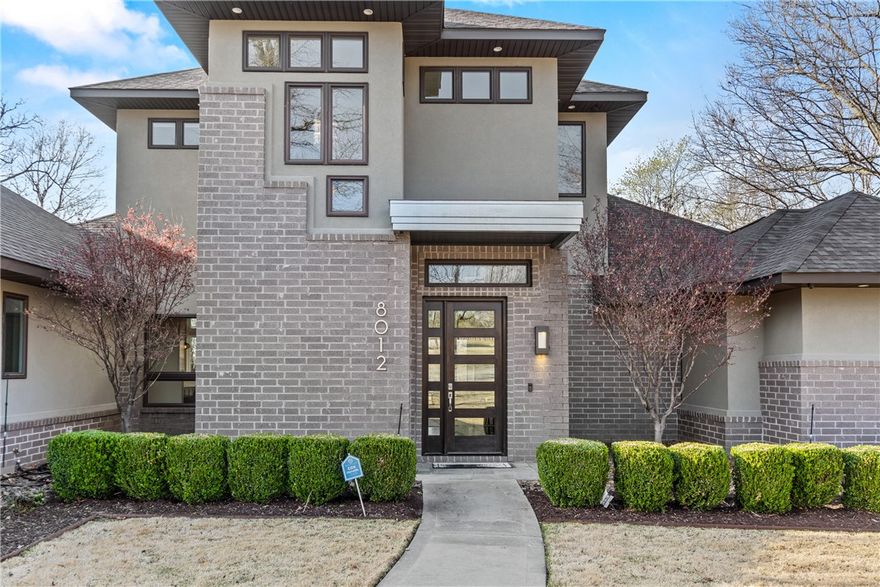 Enjoy the tranquility of a 3.45-acre property adjacent to a charming community pond. This custom-built gem boasts a spacious open floor plan with 12-foot ceilings and 8-foot solid core doors, creating an inviting atmosphere. Indulge your culinary passions in the well-appointed kitchen, equipped with double ovens, a 5-burner gas stove, stainless steel vent, center island with a sink, and soft-close cabinets—a chef's delight! Indulge in the versatility of a library/office space, perfect for productivity. Retreat to the luxurious master suite with a lavish master bath offering a soaker tub, double sinks, and a tiled shower. The upstairs features a cozy media room or great play area for children, nestled next to the two spacious bedrooms, providing entertainment and relaxation. Additional highlights include a separate laundry room and ample space for a second fridge. Conveniently located just minutes away from Bentonville, Rogers, Fayetteville, and within the prestigious Bentonville Schools—schedule your showing today!