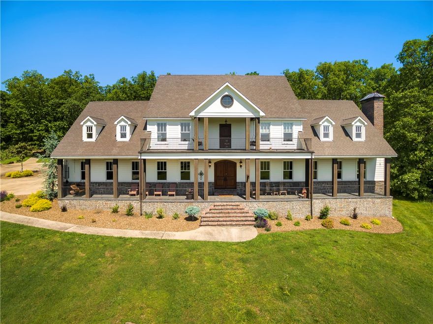 Beautiful custom built estate on 8.45 acres. Boasts Brazilian Koa wood floors, custom ceilings, wood beams, built-ins, natural lighting and many more features throughout. Large living, formal dining, eat-in gourmet kitchen w/nook, butler's pantry, wet bar, office, one-of-a-kind "Narnia" room, and each bedroom has private full bath. In-ground pool off patio w/outdoor fireplace. Detached 3 car garage w/apartment upstairs and office. Fenced property has barn w/horse stalls, practice shooting target and pond.