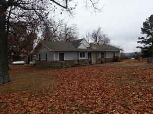 Lake View! Wonderful 4 bed, 2 bath, home on an acre joining Hwy 125. This property would make a great home or get-a-way with a lake view, large shop building, within three miles of the 125 Marina, newer HVAC, and more.