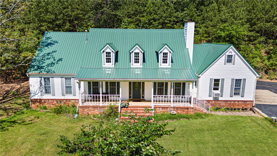 Escape to the quiet of the Ozarks with this spacious 3 bed, 2 1/2 bath home on 4 wooded acres—offering privacy, charm, and room to grow! With approximately 2,826 sqft, the main level features a cozy living space with an earth stove, a large kitchen with plenty of storage, and a comfortable layout for everyday living. Upstairs, you’ll find a small paint studio and a partially finished space already plumbed and ready for your custom touch—perfect for adding more bedrooms, a bonus room, or a second living area.
Step outside to enjoy a 2-car garage, two carports (one oversized), an 18x24 shop, and a 1,500-watt propane generator for peace of mind. The property includes a whole-home water filtration system, a private well ideal for gardening, e-glass windows for energy efficiency, and a French drain running along the back of the home. A newer metal roof (installed within the last 3 years) completes the package. Located in beautiful Ozark, this property is the perfect mix of comfort, potential, and country living!
