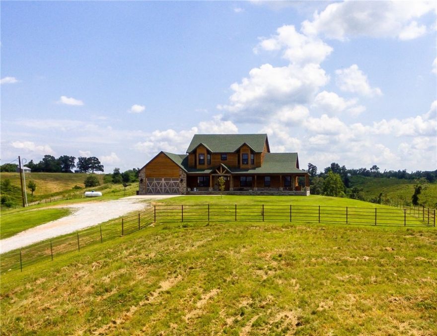 Income producing property.  Beautiful custom home with wonderful detail you are sure to fall in love with. From the wood look tile flooring throughout to the vaulted wood ceiling in the large living room, 5 bed 4.5 bath, office, bonus room in the basement, and an incredible view are just highlights. On this 384+ acres it also is home to 11 commercial eggs houses that provide this farm a good income Land is rolling with tons of new grazing. Large rural water main along front of property.