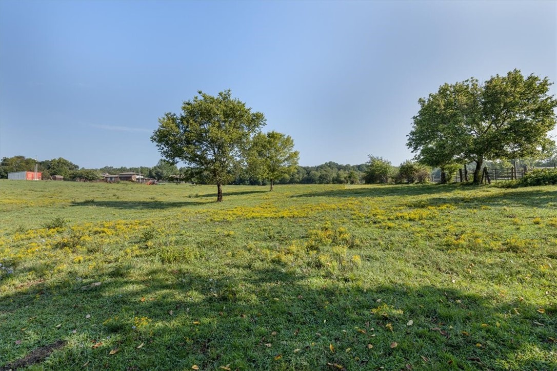 Want to live in a community with a neighborhood feel but also have some space? Build your dream home on one of these premier estate lots left located in one of NWA's most coveted areas. These exceptional lots offer the ultimate in luxury, privacy, and convenience. Located on a private, gated drive only 3 min from 112, 6 min from I-49, and 7 min to 412, these lots offer easy access to major routes, making commuting a breeze while still providing a peaceful retreat from the hustle and bustle. Nestled in a distinguished area known for its beauty and luxury homes, this location is just 5 minutes from the Blessings Golf Club. Choose from generously-sized lots ranging from 4.45-5.51 acres, each providing ample space while enjoying the benefits of a family-friendly neighborhood. Each lot boasts beautiful views with tracts 4 & 5 backing up to the spring fed Clear Creek. Each lot has been perc tested for a 5 bedroom home and will be equipped with water, electric, & natural gas. Only 3 out of the 5 lots still available!