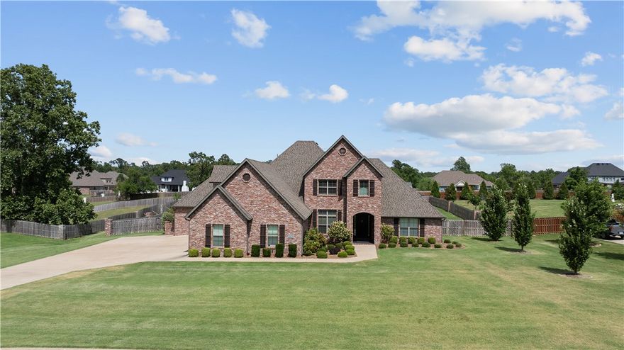 New heated saltwater pool! 5 Bedrooms 5.5 Baths, 2 living Areas plus a Bonus Room. Impressive kitchen complete with double oven, gas cook top, pot filler, built in commerical size refrigerator/freezer. We aren't sure how you will fill all of the cabinets. Dining room, breakfast area and eat in kitchen/bar area. The primary suite has a huge custom closet that connects to the laundry room.  2 more bedrooms on the main floor both with full baths. Upstairs: a 2nd master, another bedroom with bath and a bonus room/living room with wet bar. A four car garage that is large enough for full size trucks and SUV's. Covered patio with built in grill and hot tub, over looking a huge fenced back yard and pool area with even more room beyond the fence on a 1.32 acre lot. Every room seems more expansive than the last.