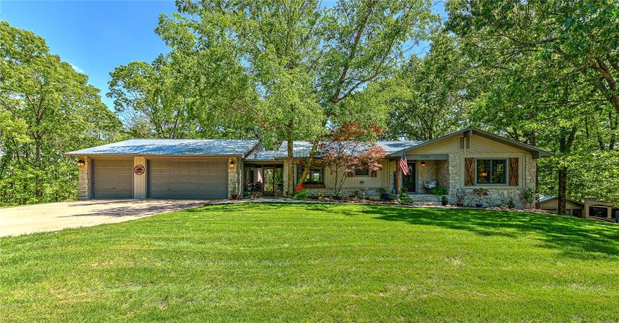 This is your chance to own an absolute stunner located in one of Beaver Lake's finest little coves! Fantastic location in Little Coose Hollow-12 minutes by land to Downtown Rogers, 5 minutes by water to Prairie Creek Marina. Lake front home has 2-slip PRIVATE dock with one 6,700 lb lift, oversize swim deck and brand new steps leading down to the dock (5/24). Has RV parking, a 20x25 detached shop with a new roof, and 3-car garage with additional workspace off the main garage. If you prefer to stay home, you can relax on the spacious upper deck, in the light and airy sunroom with new screens or in the 6-person hot tub on the private, shady lower deck. Interior has been fully updated this year with soft-close cabinets and drawers, marble countertops, new doors with hinges and hardware, paint, trim, baseboards and flooring. Brand new sod front and back and updated deck railing add to the allure of the outside of this exceptional Lake House. All furnishings, boat and equipment are negotiable with acceptable offer.