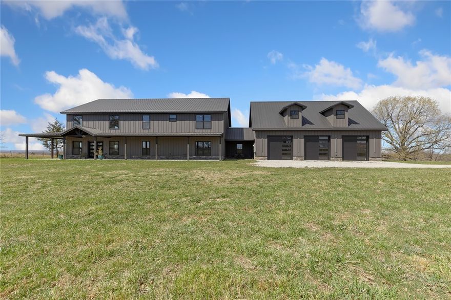 Modern luxury meets country serenity on nearly 50 acres! Built in 2024, this striking black-on-black-on-black custom home offers 4 spacious bedrooms, 4.5 baths, and two master suites—perfect for multigenerational living or guests. Inside, you'll find leathered Negresco granite throughout the home, adding a bold, elegant touch to the kitchen and all bathrooms. Take in the breathtaking 320-degree views from nearly every angle. The main home is thoughtfully designed and already wired for a future pool, with a hot tub plug ready to go on the back porch. An oversized 3-car garage provides not just parking but potential—with a separate entrance to finished living space above, including a small bedroom, living room, full bathroom, and finished storage rooms. Ideal for guests, an office, or additional income. All of this is nestled on 49.51 surveyed acres, just a short distance off pavement in the quiet town of Everton—less than 30 minutes from Harrison. A rare blend of style, space, and seclusion.