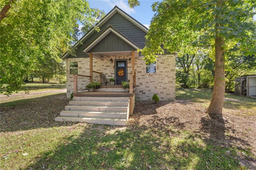 Situated on nearly an acre, this custom home offers the perfect mix of space and convenience with easy access to Harrison, Branson, and Highways 65 and 412. Built in 2022, it features four bedrooms and two bathrooms, with the primary suite, two bedrooms, and both baths on the main level. Upstairs includes a fourth bedroom and a large bonus room with attic storage. Inside, vaulted pine ceilings, wood and tile flooring, and a kitchen with stainless appliances and plenty of storage make the home both comfortable and stylish. Outside, you’ll enjoy a 28x30 shop with electric, a smokehouse, and animal quarters. With rural water and an additional private well in place, this property is as practical as it is inviting.