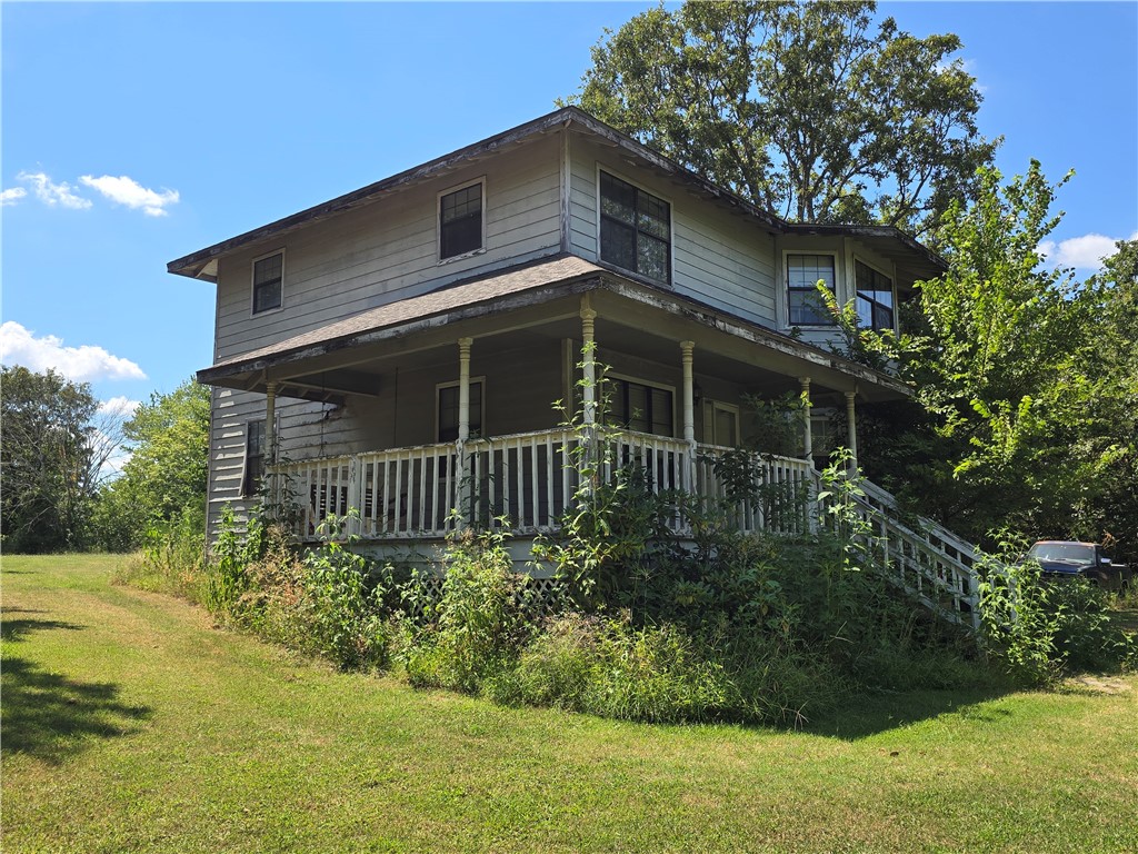 ***Public Real Estate Auction Thursday, September 11th at 10:00AM.*** 1,600 SF 2 story home on 5.19 Acres+/-. This auction will include two lots. The house sits on a 2.54 ac lot. Additional 2.65 AC lot is empty but has its own water meter, electric & septic. A little clean up and you're ready to build. Existing house needs work but could make a nice place. Wrap around covered porch, 3 BR 2 BA, couple of storage sheds and an enclosed coop that could be used for poultry or any other small animals. Property is only 2.2 miles from Garfield.