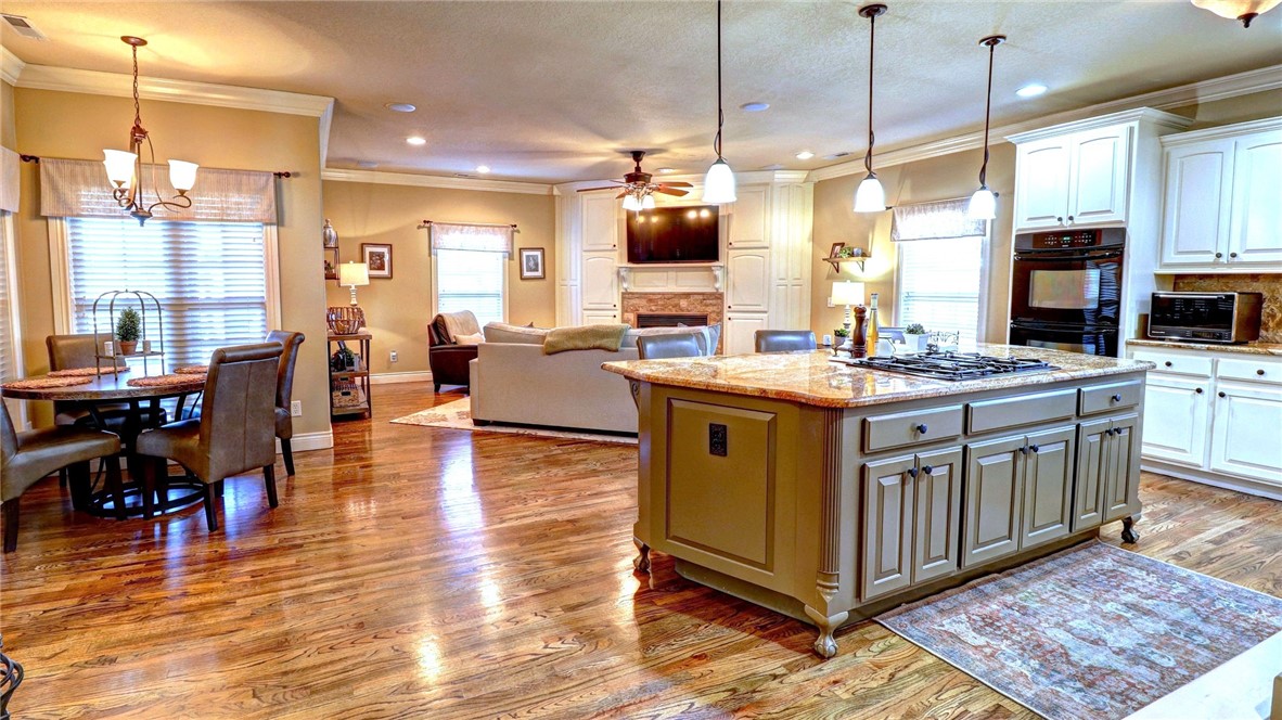 Stunning home available in sought after Creekwood subdivision!! This well-maintained home features 5 bedrooms plus a bonus room, 3.5 bathrooms, large open kitchen with elegant finishes, beautiful backyard w/covered patio & private in ground pool! Spacious primary bedroom with updated ensuite bathroom and large closet. Three bedrooms upstairs with bonus and wet bar. Open and airy with lots of natural light, 3 car attached garage. The Creekwood community also features a community pool w/pool house and a playground. Excellent SW Rogers location!! Downstairs heat and air replaced in 2022, both hot water heaters replaced 3 years ago w/recirculating pumps, roof 2008 w/40 yr. shingles. The pool is vinyl with a 2 year old gas heater.
