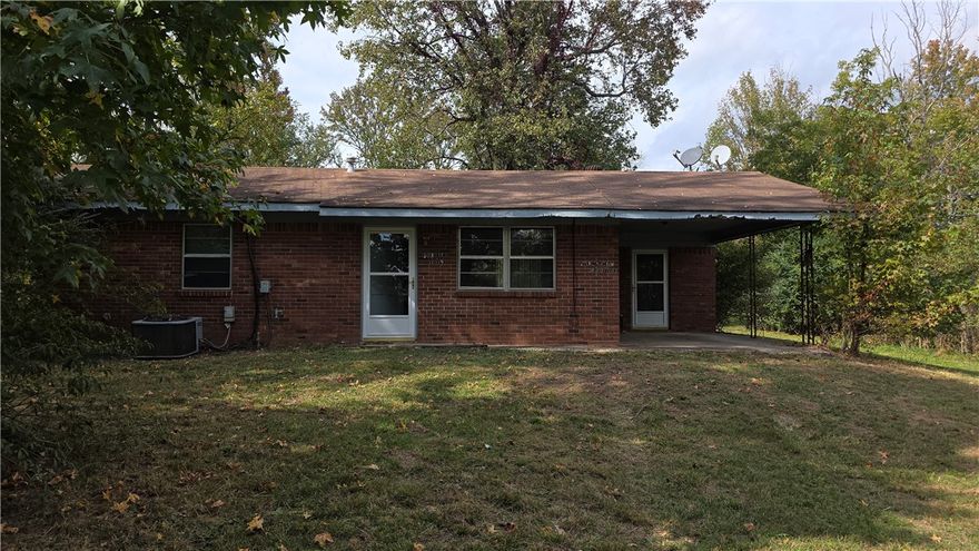 3 bedroom one bath brick home on an acre in Hector. There is room to garden, cookout, and add a shop. The home is on a slab. Catty corner across the highway from Hector Schools. AGENTS: Please see agent remarks for details on priority for offers.