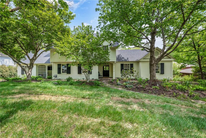 Home with timeless elegance offered 1st time in 75 yrs. Steps from Wilson Park & Greenway, a mile from campus & downtown. Built in 1931, renovated & expanded in 2000.  Charming details throughout. Large Dutch doors lead thru foyer to expansive porch, courtyard, stone terrace & fountain. Paneled doors open to large LR with fireplace & 2 pr French doors to porch.  DR with bay window & corner cabinets.  Elegant stair hall leads to study with bookcases & bay window.  Morning light floods spectacular kit/den with fireplace, bfast bar, marble counters, screen porch.  Primary suite with private entrance includes bdrm, bath, dressing room, ample closets, laundry; dutch door & bay window overlook gardens. Curved drive to private parking on oversized lot with room for pool & garage. Adjacent guest cottage with wrap-around deck, LR/DR with cathedral ceiling, fireplace, kitchen, bdrm, bath, laundry.  Perfect for intergenerational living, executive rental, Airbnb. Rare opportunity in a coveted neighborhood.