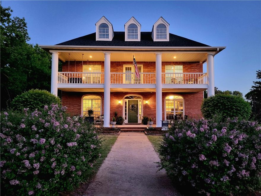 Stunning colonial charmer on nearly 3 acres in Mountain View Estates Subdivision. This well-maintained beautiful home has received recent updates and remodels in the key areas, including new flooring, paint, updated counters, kitchen remodel, bathroom updates, new roof in 2020, and upstairs carpet is newer.  All of this on a level private lot that includes an oversized 3-car garage with workshop and bathroom, multiple exterior entertainment areas both covered and uncovered, and a circle drive to greet guests as they come to sit under the two covered front porches and enjoy the evening sunsets.