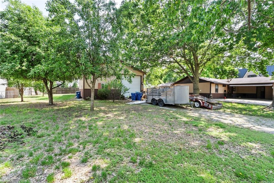 Opportunity of a lifetime awaits! This property presents a massive remodel opportunity in an absolutely unparalleled location. Situated on an expansive lot (composed of three separate parcels), you're just steps away from the vibrant Bentonville Square and The Momentary, offering instant access to world-class art, culinary experiences, shops, cultural events, and biking trails. For the visionary, offers immense potential to be transformed into a stunning single-family residence, or, given its generous three-lot expanse, the possibility to develop two separate homes. The existing structures include a detached garage with a dedicated office space, perfect for today's remote work needs. This is also listed with another home as a .75 acre parcel with additional shop buildings and a pool. Perfectly situated for those seeking the ultimate Bentonville lifestyle, combining a prime location with versatile amenities. Bring your creativity and reimagine it entirely to fit your dreams.