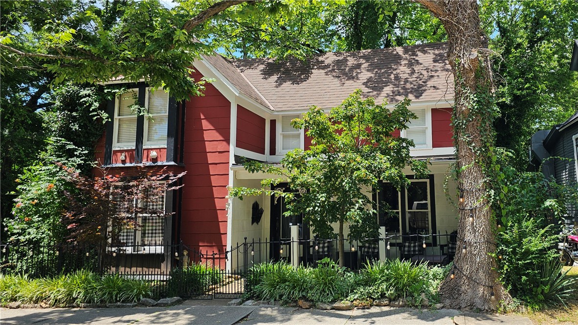 Possible owner financing to qualified buyers. Tea Cup cottage is a very successful AirBnB located on the "Historic loop" and many walking trails and sidewalks that connect to shopping and entertainment in beautiful Eureka Springs. The kitchen has stainless steel appliances and granite countertops. The kitchen opens up to a large deck perfect for entertaining. The master suite is on the main level. There are 2 bedrooms upstairs and room to add a half bath that the Seller will give $5000. allowance at closing towards the installation. The property has had many upgrades, 4 mini splits for zoned heating and air. More info can be found on "Evolve" site, where you can make a reservation to stay. This also listed in residential #1305454