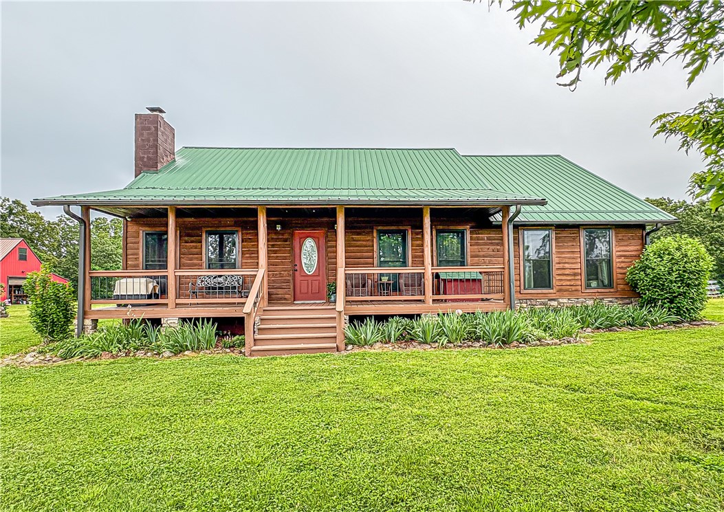 Discover your own slice of paradise with this stunning 50-acre m/l property, perfectly blending rural charm with modern comforts. Nestled just under 5 miles from town, you can enjoy the best of both worlds-the serenity of rural life and the convenience of nearby amenities.
With 50 acres of lush land, this property is ideal for farming, gardening, or recreational activities. The property is fully fenced and cross-fenced, has a pond, a freeze proof cattle waterer and corral and year-round spring. The 40x50 barn and additional workshop are perfect for the hobbyist or farmer.
The charming 3-bedroom, 2-bathroom home boasts a warm, welcoming atmosphere with pine floors, doors and trim to enhance the rustic charm. Also included are walk-in closet, energy efficient windows, and a whole-house generator.