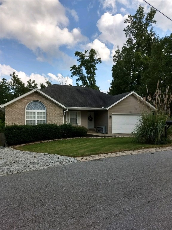 Very nice home on large lot with fenced back yard. Parking pad in back for RV or boat. Beautiful hardwood floors and granite countertops. House has already been hooked up to public sewer. Home has 2 bonus areas with outside access workshop/mancave/storage.