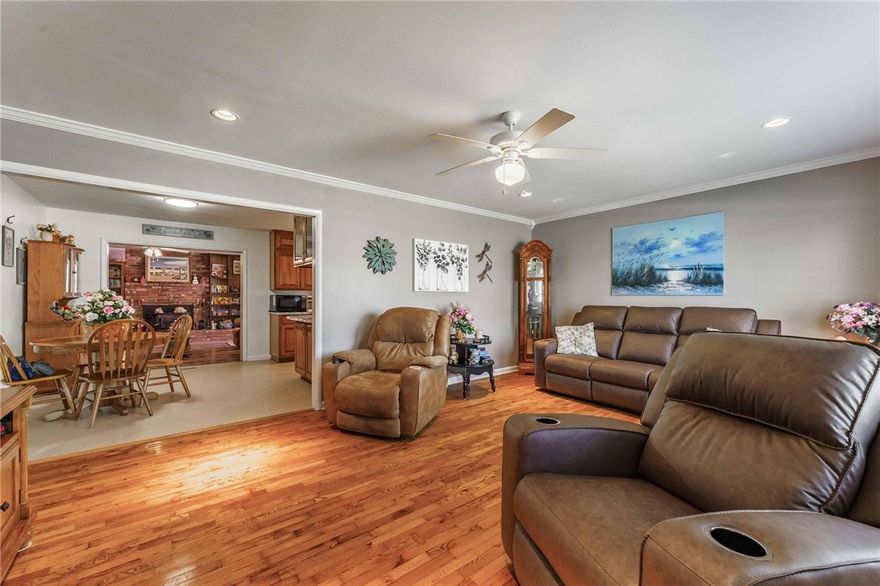 Welcome Home to 521 S. 13th Street.   This 3 bedroom, 2 bath home has beautiful original hardwood floors throughout.  The kitchen offers plenty of cabinets plus a built-in pantry with fold-out shelving for additional storage.  In the family room, you will find a large wood burning fireplace surrounded by built-in shelving & storage.  A great back deck for a nice evening grilling or just sitting outside with easy access from the family room or kitchen.   In addition to the 1 car carport with storage, the oversized 40ft x 20ft detached garage offers parking for 2 vehicles, plus a large amount of space for workshop and additional storage. Many recent updates include a New Roof, blown in insulation in the attic, living room drywall, & all new window screens in 2024. Electric meter box upgraded in 2022.  Located just minutes from Historic Downtown, bike trails, lakes, shopping, and everything Rogers has to offer.  The home has direct access to the 13th St. Greenway which is part of the Rogers Greenway/Trails system.