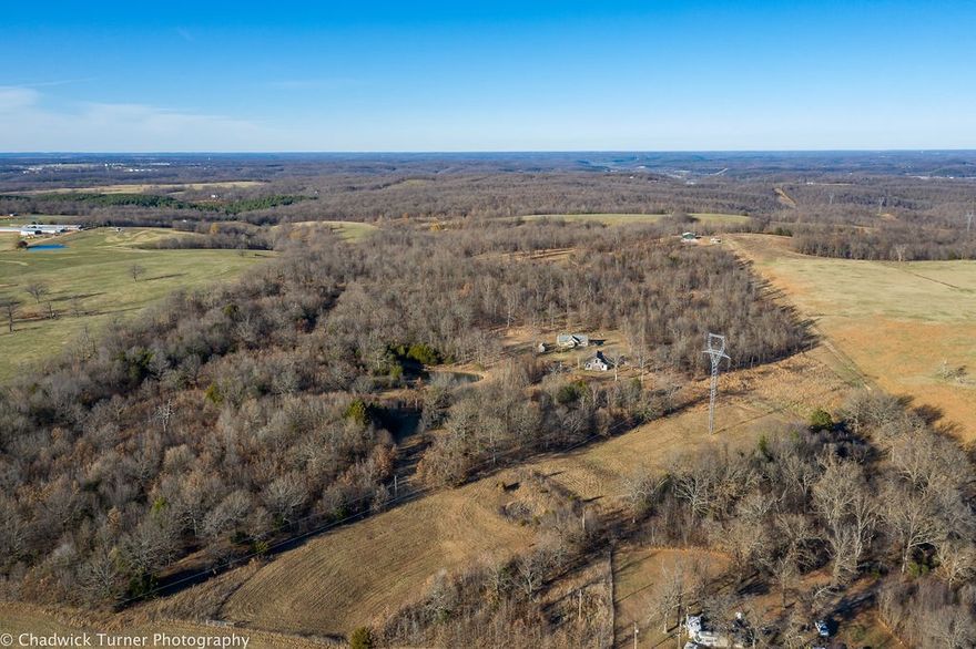 Possibilities in the country! Nestle your dream home right in the trees and call this home! Partially wooded acreage that could be just what you are looking for. Great location that provides you the country setting and seclusion, yet just minutes away from town. Come see the potential this one has today!