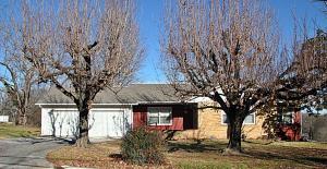 Great location, large yard, 3 car garage, large trees. 3 bedroom, 2 bath, hardwood floors, central heat & air with a backup wall space heater. Workshop area located in the walkout, garage door basement.