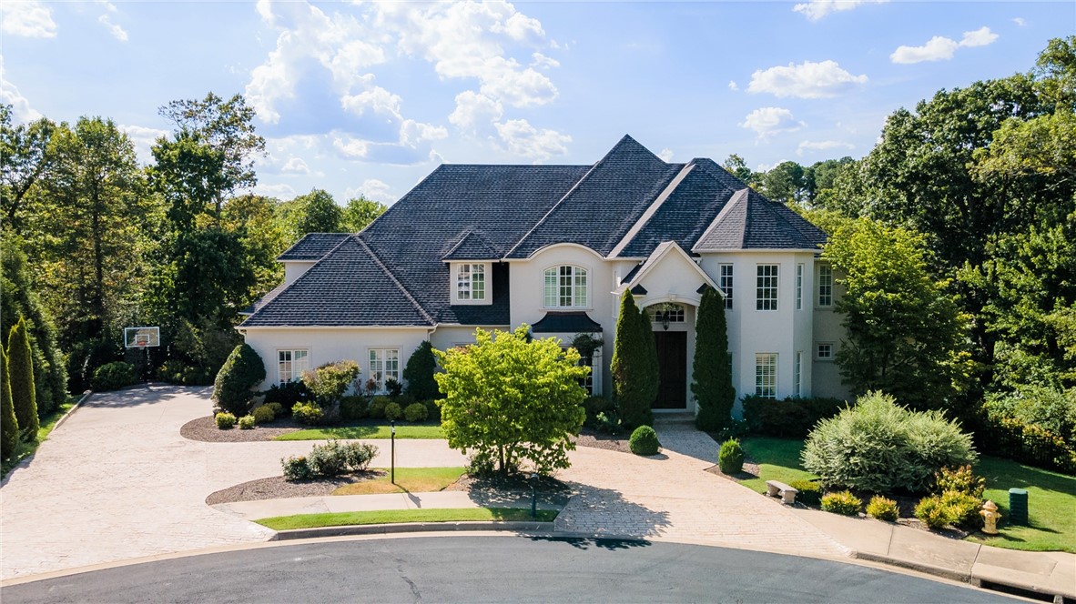 STUNNING 5 bedroom home on Blessings Golf Course in gated Clear Creek subdivision. Amazing views of the 12th and 13th fairways and the charming wood cart path bridge. Amenities galore include Formal Living Room, Dining Room, Office, Bonus Room, Playroom, Exercise Room, 5 Full Baths, 2 half baths, and all bedrooms feature en suites. Stunning gourmet Chef's Kitchen remodel by distinguished decorator. Kitchen features include granite and marble counter tops and 2 islands. Seller has completed many updates! Main level hardwood floors newly refinished. Elegant newly painted brick, cast stone and stucco exterior in 2022. Stamped concrete walkways nestled in beautiful mature landscaping. Enjoy endless opportunities for entertaining both in spacious interior and outdoors! Don't miss the opportunity to buy this spectacular property!