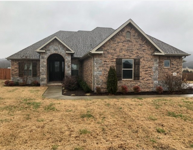 Great home in Prairie Grove; has 3 bed and 2.5 baths; roof and insulation were upgraded in construction in 2017; 1.12 acres and per plans 2300 sq ft; added security of a safe room that may withstand very high winds--3rd garage has been wired to convert to workshop and is insulated; surround sound and hot tub has concrete pad..Hot Tub will convey. Privacy fence and Energy Star appliances