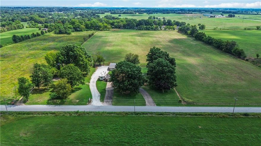 Prime business opportunity in a growing Springdale corridor. Currently used as a residence with a family-owned window covering business operating from the 1,888 SF shop, this property offers excellent flexibility for commercial or mixed-use potential.

Located near the proposed Springdale East 412 Bypass and near future Primrose Road improvements, the area is positioned for growth and improved accessibility.

The property includes a well-maintained 3-bedroom, 2.5-bath home that could function as office space, rental income, or on-site living. The 1,888 SF shop features finished space suitable for showroom, office, or light industrial use, plus ample storage.

Situated on just over one level acre with easy access to Highway 71 Business and I-49, this property offers room to expand and strong long-term potential in Northwest Arkansas.