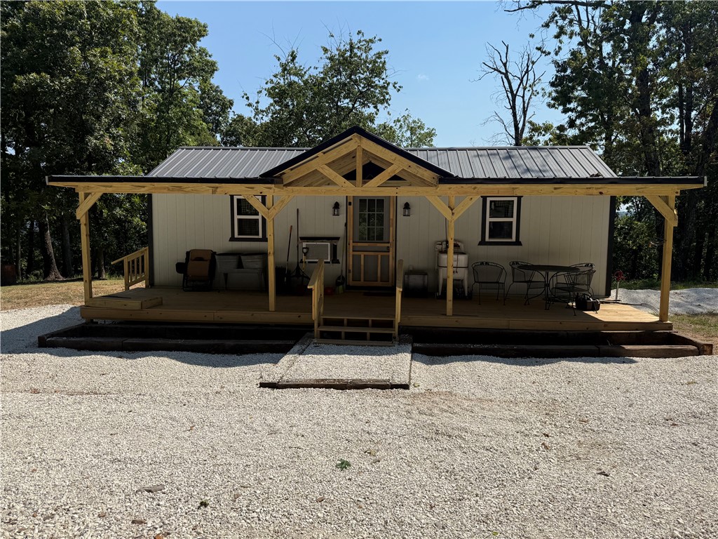 What more do you need, easy living at its best. New everything, new septic system, Washington Water Authority, OzarksGo fiber, and convenient to all NW Arkansas has to offer. Just far enough out of town to enjoy the Ozark Mountains with room to make it your own. 5 acres with views and storage shed convey with property. Home is all new inside, electric hot water heater, ac and heat unit, metal roof, low maintenance all the way around. Close to Devils Den state park with abundant wildlife to enjoy, deer, turkey. Priced to sell.