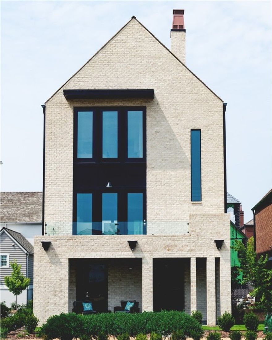 This stunning home is located in the heart of town, offering an unbeatable location and unbeatable luxury. This new development in Pinnacle Village is situated off of Pinnacle Hills Parkway behind the Walmart Neighborhood Market. Each unit features high-end finishes including hardwood floors, 10' ceilings, 8' interior doors, designer light fixtures & a Smart Thermostat. The open kitchen features quartz counter tops & high end stainless steel appliances with a gas range. This unit is complete with an elevator for easy access to all levels. The bedroom on the bottom level can serve as the perfect mother-in-law suite or a guest room with total privacy. Spacious 2 car garage with an 
EV outlet. Additionally, the property is within walking distance to the Walmart Amp, Top Golf, the best restaurants, shopping, entertainment and so much more! Whether you are looking for a place to call your own or an investment property, this home offers the best of both worlds.