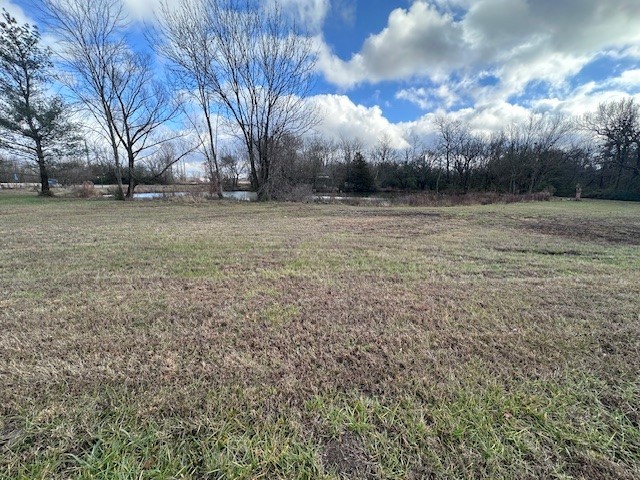 Prime location for development, currently zoned Agricultural and Commercial C-1. Large pond/lake on the East side stocked with 1,000 plus Catfish. Approximately 11.25 acres zoned Agricultural and Commercial. 2 homes included. Several use options with this prime parcel in a coveted area of NWA. High traffic count. 12" Sewer on Site. Owner may consider some owner financing. Terms to be determined. Great site for a restaurant on the water, apartments, business park, etc..???
